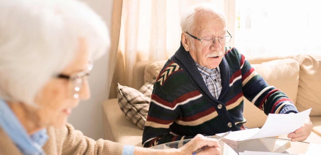 Two generations of a family talking something through at home